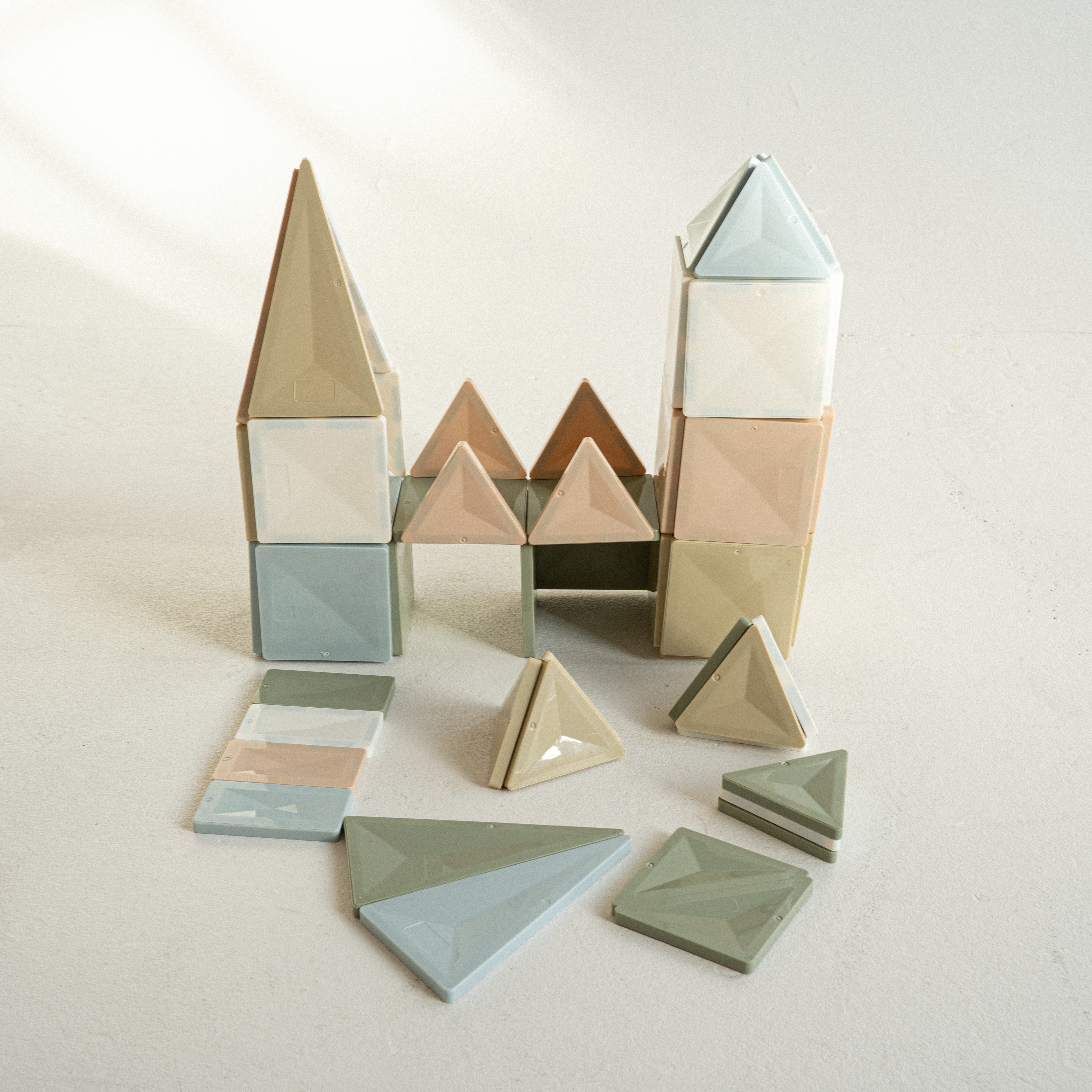 Magnetic tile tower built by child