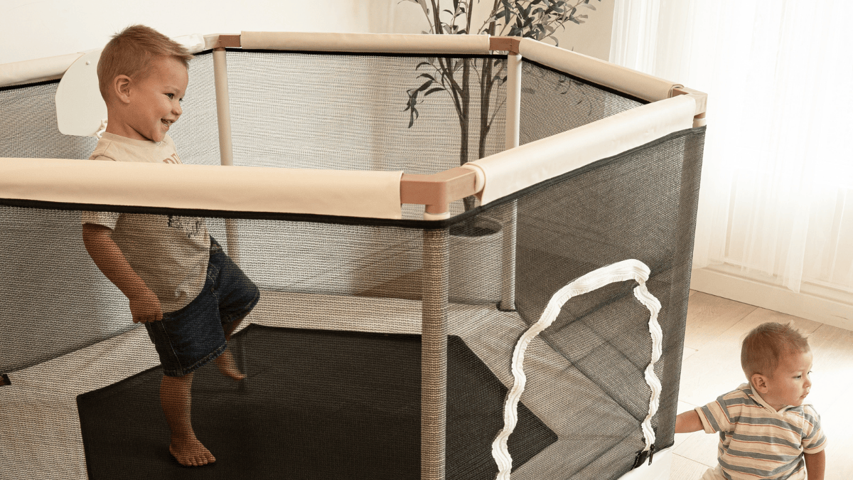 Kids playing on Square House indoor trampoline in modern living room