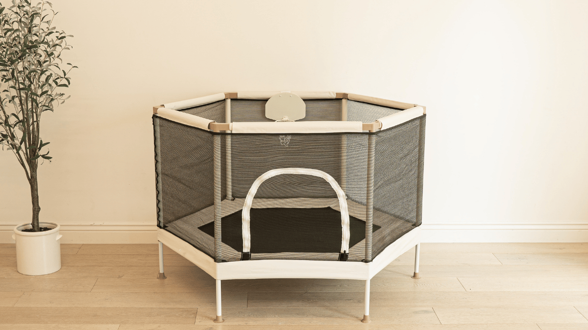 Modern living room with hidden aesthetic toy storage in woven baskets and neutral cabinets