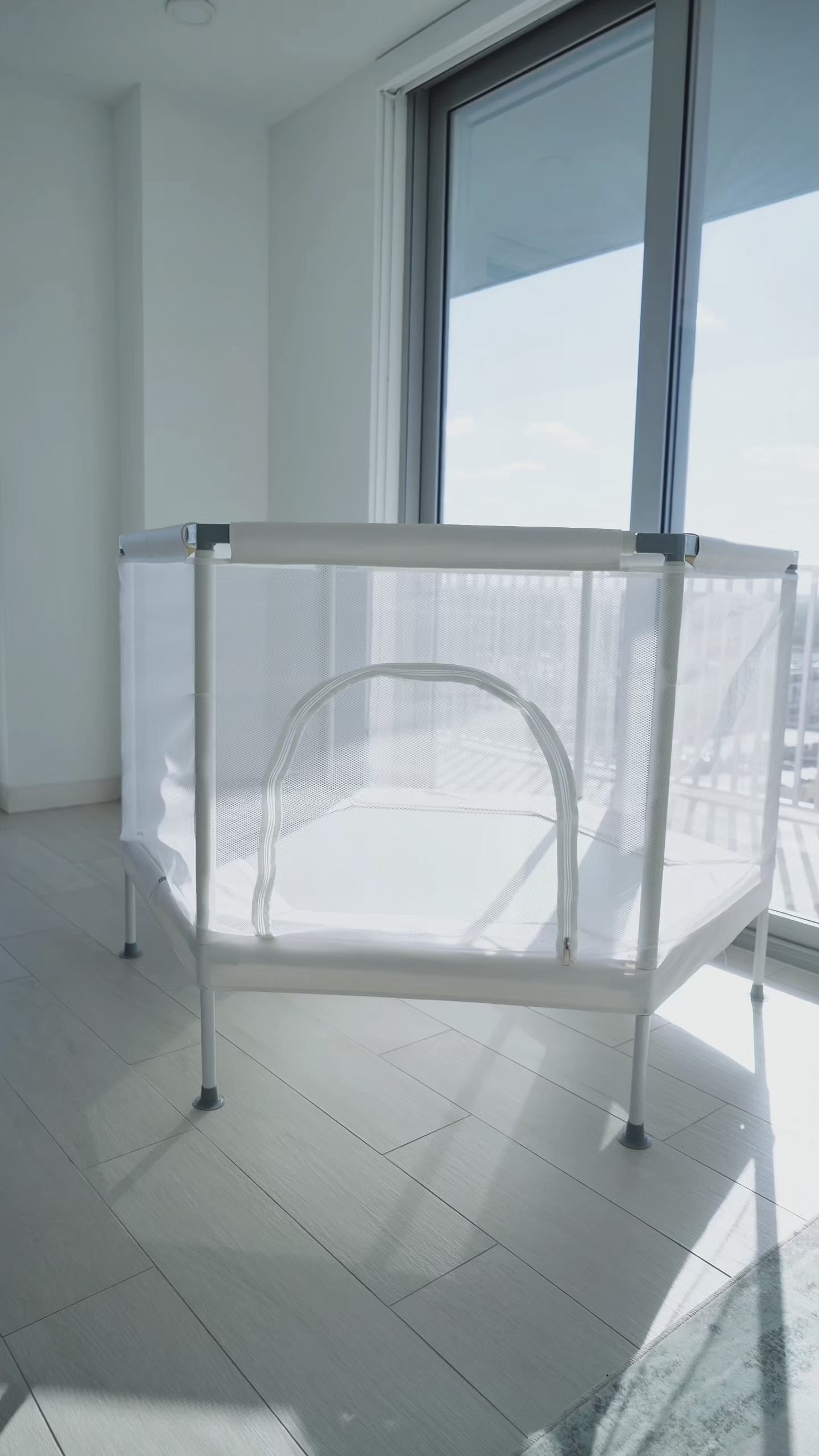 Kids indoor trampoline with safety net in modern living room